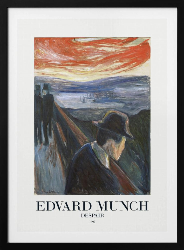 A framed art print of Edvard Munch's 1892 painting, 'Despair'. The expressionist artwork depicts a man in a dark coat and hat leaning over a bridge railing in profile, with a fiery red and orange sunset in the background. Below the image, text reads 'EDVARD MUNCH DESPAIR 1892'. Print