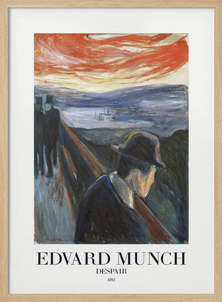 A framed art print of Edvard Munch's 1892 painting, 'Despair'. The expressionist artwork depicts a man in a dark coat and hat leaning over a bridge railing in profile, with a fiery red and orange sunset in the background. Below the image, text reads 'EDVARD MUNCH DESPAIR 1892'. Print