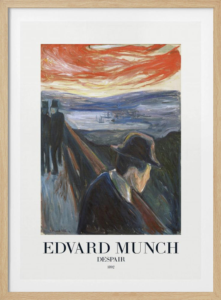 A framed art print of Edvard Munch's 1892 painting, 'Despair'. The expressionist artwork depicts a man in a dark coat and hat leaning over a bridge railing in profile, with a fiery red and orange sunset in the background. Below the image, text reads 'EDVARD MUNCH DESPAIR 1892'. Print