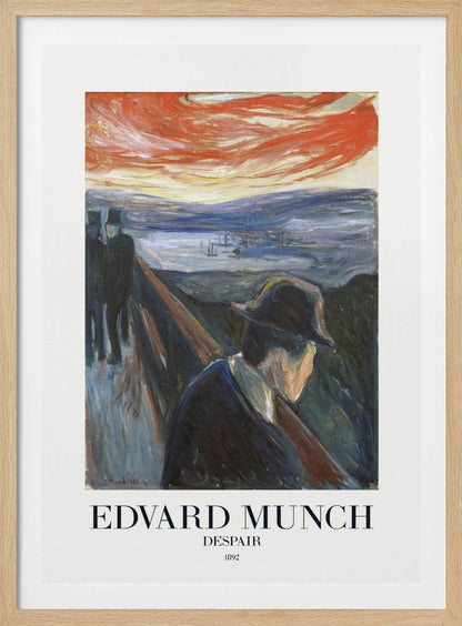 A framed art print of Edvard Munch's 1892 painting, 'Despair'. The expressionist artwork depicts a man in a dark coat and hat leaning over a bridge railing in profile, with a fiery red and orange sunset in the background. Below the image, text reads 'EDVARD MUNCH DESPAIR 1892'. Print