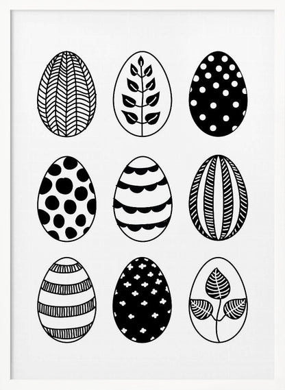 A black and white art print featuring a 3x3 grid of nine illustrated Easter eggs. Each egg has a unique, hand-drawn pattern, including polka dots, stripes, chevrons, florals, and leafy branches, all within a thin black frame. Poster