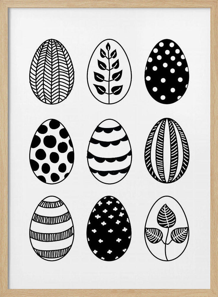 A black and white art print featuring a 3x3 grid of nine illustrated Easter eggs. Each egg has a unique, hand-drawn pattern, including polka dots, stripes, chevrons, florals, and leafy branches, all within a thin black frame. Poster