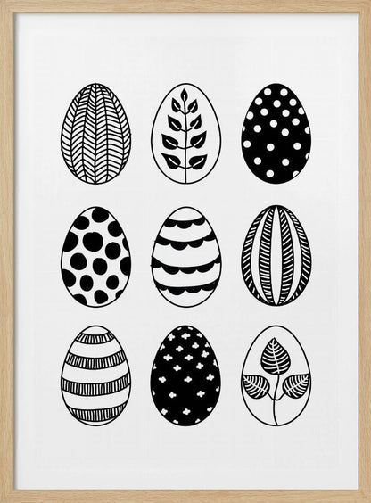 A black and white art print featuring a 3x3 grid of nine illustrated Easter eggs. Each egg has a unique, hand-drawn pattern, including polka dots, stripes, chevrons, florals, and leafy branches, all within a thin black frame. Poster