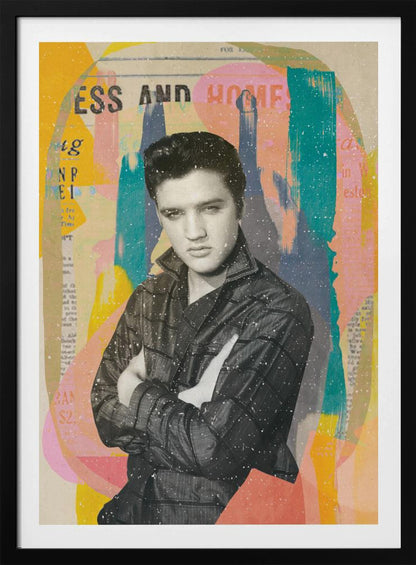 A pop art style collage of a young Elvis Presley. The portrait is in black and white, showing him with his arms crossed and a serious expression. The background is an abstract mix of colorful shapes in yellow, teal, orange, and pink, with fragments of newspaper text visible. The entire piece is covered in a light white speckle effect and is shown in a black frame. Print