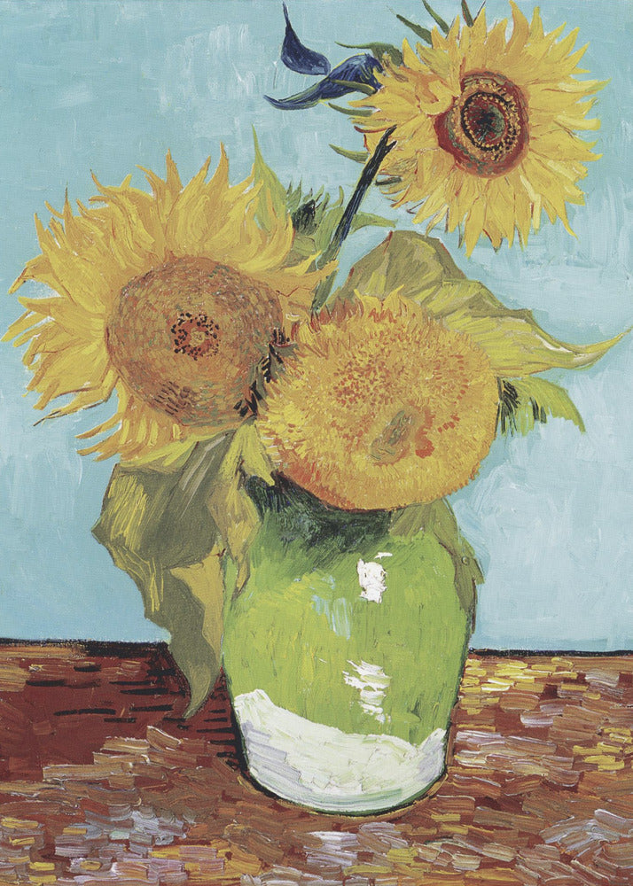 A framed reproduction of Vincent van Gogh's famous 'Sunflowers' painting, featuring three large yellow sunflowers in a green vase against a light blue background, painted in his iconic post-impressionist style with thick brushstrokes. Wall Art