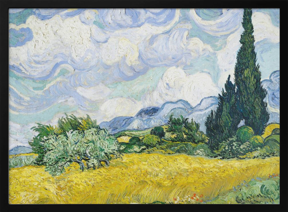 A framed print of Vincent van Gogh's painting 'Wheat Field with Cypresses.' The artwork depicts a vibrant golden wheat field under a dynamic sky filled with swirling white and blue clouds. A tall, dark green cypress tree dominates the right side, with rolling green hills and distant blue mountains in the background. Decor