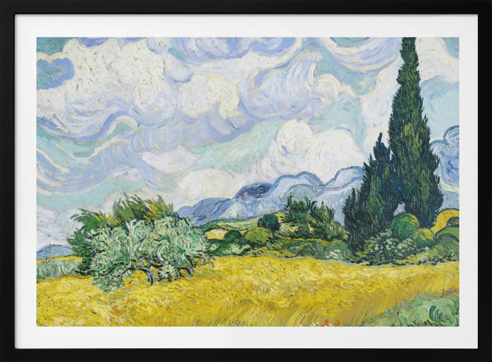 A framed print of Vincent van Gogh's painting 'Wheat Field with Cypresses.' The artwork depicts a vibrant golden wheat field under a dynamic sky filled with swirling white and blue clouds. A tall, dark green cypress tree dominates the right side, with rolling green hills and distant blue mountains in the background. Decor