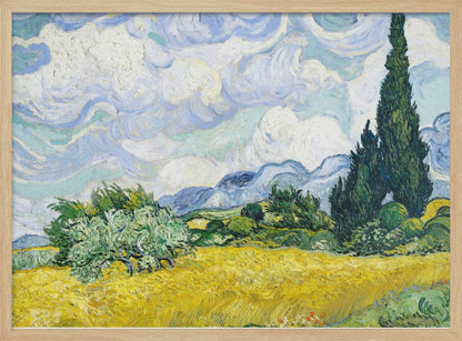 A framed print of Vincent van Gogh's painting 'Wheat Field with Cypresses.' The artwork depicts a vibrant golden wheat field under a dynamic sky filled with swirling white and blue clouds. A tall, dark green cypress tree dominates the right side, with rolling green hills and distant blue mountains in the background. Decor
