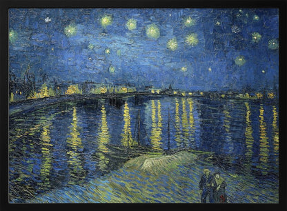 A framed print of Vincent van Gogh's painting, 'Starry Night Over the Rhône'. The artwork features a deep blue night sky filled with glowing yellow stars above a city skyline. The city lights and stars cast long, shimmering yellow reflections on the dark blue water of the river. In the foreground, two small figures of a couple are seen walking along the riverbank. Artwork