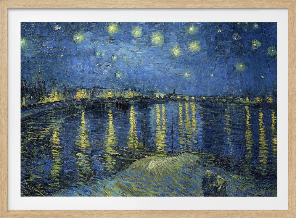 A framed print of Vincent van Gogh's painting, 'Starry Night Over the Rhône'. The artwork features a deep blue night sky filled with glowing yellow stars above a city skyline. The city lights and stars cast long, shimmering yellow reflections on the dark blue water of the river. In the foreground, two small figures of a couple are seen walking along the riverbank. Artwork