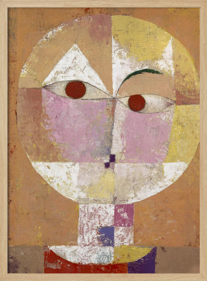 An abstract portrait painting of a stylized head, often identified as Paul Klee's 'Senecio'. The face is composed of geometric blocks of color, including pink, yellow, and white, with two prominent red circles for eyes, all set against a textured, earthy orange and brown background within a black frame. Print