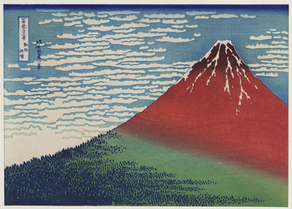 A Japanese woodblock print, Hokusai's 'Fine Wind, Clear Morning', showing a large, reddish-brown Mount Fuji with snow at its peak. Below the mountain is a dense green forest, and above is a blue sky with rows of white, stylized clouds. Print