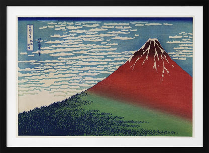 A Japanese woodblock print, Hokusai's 'Fine Wind, Clear Morning', showing a large, reddish-brown Mount Fuji with snow at its peak. Below the mountain is a dense green forest, and above is a blue sky with rows of white, stylized clouds. Print