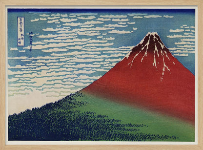 A Japanese woodblock print, Hokusai's 'Fine Wind, Clear Morning', showing a large, reddish-brown Mount Fuji with snow at its peak. Below the mountain is a dense green forest, and above is a blue sky with rows of white, stylized clouds. Print
