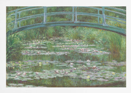 An Impressionist painting by Claude Monet depicting a green Japanese-style footbridge arching over a tranquil pond filled with blooming water lilies and lily pads, all rendered in soft, dappled brushstrokes and framed in a modern silver frame. Print