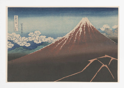 A classic Japanese ukiyo-e woodblock print by Hokusai, 'Thunderstorm Beneath the Summit', depicting a reddish-brown Mount Fuji with its snowy peak against a blue sky. Stylized clouds gather below the summit, and a fork of lightning illuminates the dark landscape at the mountain's base. Print