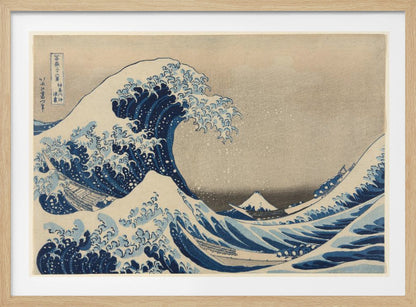 The Great Wave off Kanagawa by Hokusai, a famous Japanese ukiyo-e woodblock print. It depicts a massive, deep blue wave with claw-like white foam cresting and about to crash over three boats, with a small, snow-capped Mount Fuji visible in the background under a pale, graded sky. Artwork