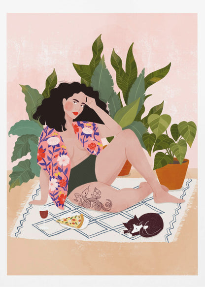 An illustration of a woman with dark curly hair relaxing on a patterned blanket indoors. She is wearing a green swimsuit and a pink floral shirt, with a prominent snake tattoo on her thigh. Next to her is a slice of pizza, a glass of red wine, and a sleeping black and white cat, all set against a backdrop of large green houseplants and a pink wall. Artwork