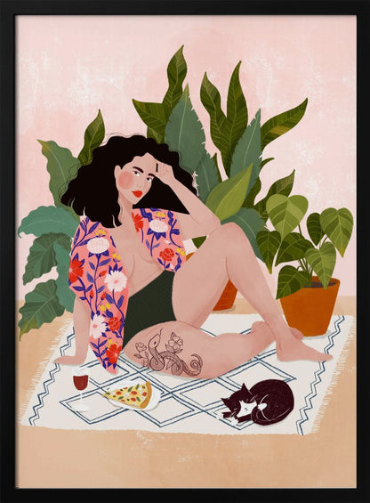 An illustration of a woman with dark curly hair relaxing on a patterned blanket indoors. She is wearing a green swimsuit and a pink floral shirt, with a prominent snake tattoo on her thigh. Next to her is a slice of pizza, a glass of red wine, and a sleeping black and white cat, all set against a backdrop of large green houseplants and a pink wall. Artwork