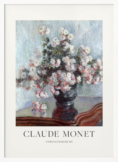 A framed art print of Claude Monet's impressionist painting, 'Chrysanthemums.' The painting features a lush bouquet of pink and white chrysanthemums in a dark vase resting on a reflective, mahogany-colored table against a light blue, textured background. The print includes a white border with the artist's name and the title below the artwork, all enclosed in a simple black frame. Print