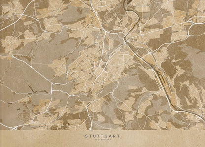 A framed, stylized map of Stuttgart, Germany, in shades of brown and beige. Major roads and waterways are highlighted in a contrasting cream color, creating a detailed and modern look. The city name 'STUTTGART' is written at the bottom. The entire map is enclosed in a simple silver-colored frame. Poster