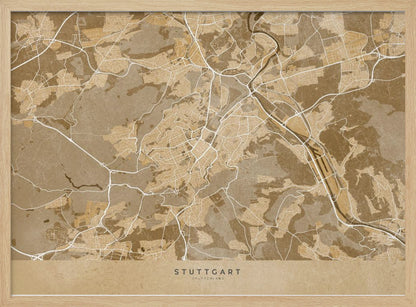 A framed, stylized map of Stuttgart, Germany, in shades of brown and beige. Major roads and waterways are highlighted in a contrasting cream color, creating a detailed and modern look. The city name 'STUTTGART' is written at the bottom. The entire map is enclosed in a simple silver-colored frame. Poster