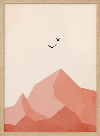 A minimalist framed artwork featuring geometric, faceted mountains in shades of pink and coral against a light cream sky. Two small black birds are shown flying above the peaks, creating a serene and modern nature scene. Wall Art