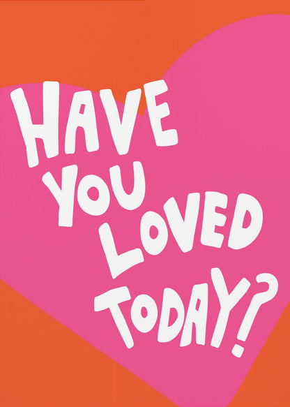 A framed art print with the text 'Have you loved today?' in a playful white font. The text is centered on a large pink heart which is set against a vibrant orange background. Artwork
