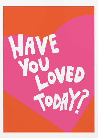A framed art print with the text 'Have you loved today?' in a playful white font. The text is centered on a large pink heart which is set against a vibrant orange background. Artwork
