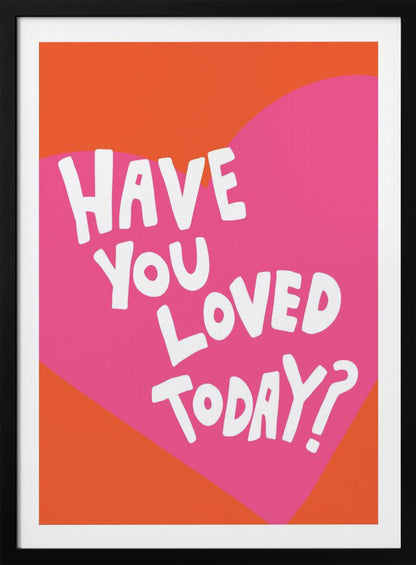 A framed art print with the text 'Have you loved today?' in a playful white font. The text is centered on a large pink heart which is set against a vibrant orange background. Artwork
