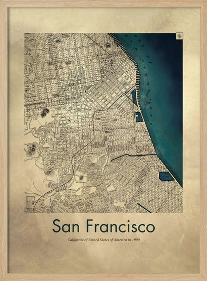 A framed vintage map of San Francisco from 1900. The map is detailed on aged, beige paper, with the bay depicted in a deep teal blue. Below the map, text reads 'San Francisco' and 'California of United States of America in 1900'. Artwork