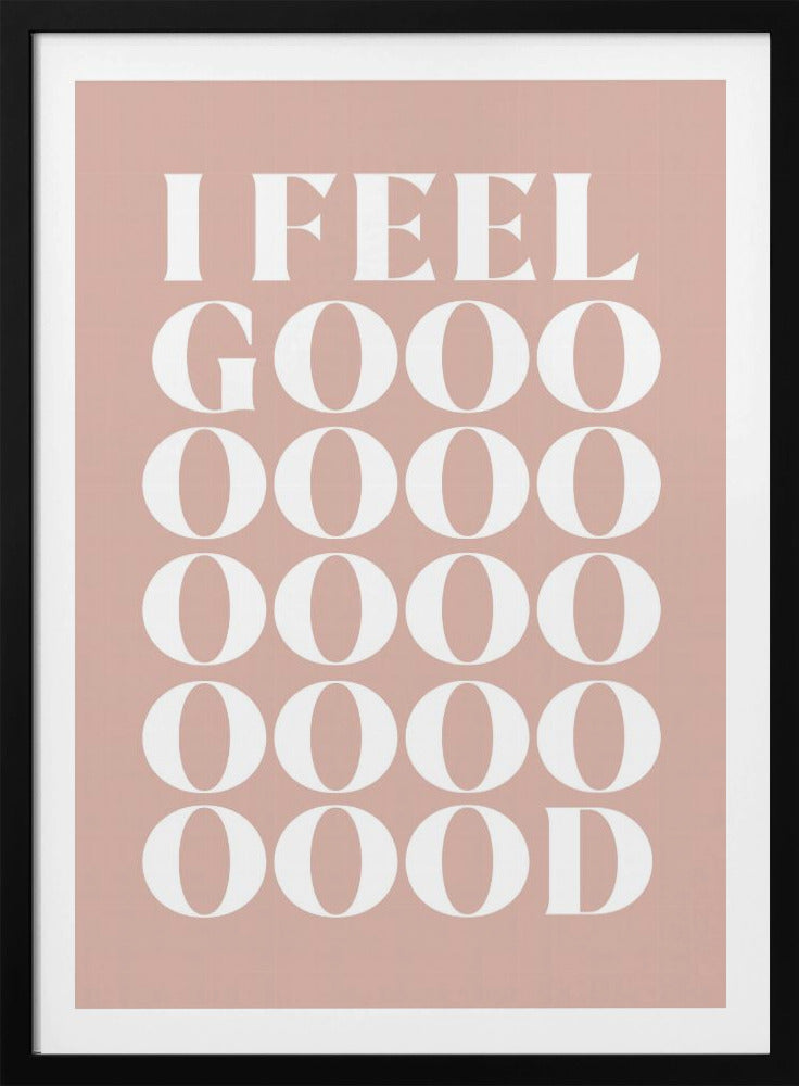 A framed typographic poster featuring the words 'I FEEL GOOOOOD' in a large, white serif font against a dusty pink background. The word 'GOOD' is stylized and stretched vertically with multiple rows of the letter 'O'. Artwork
