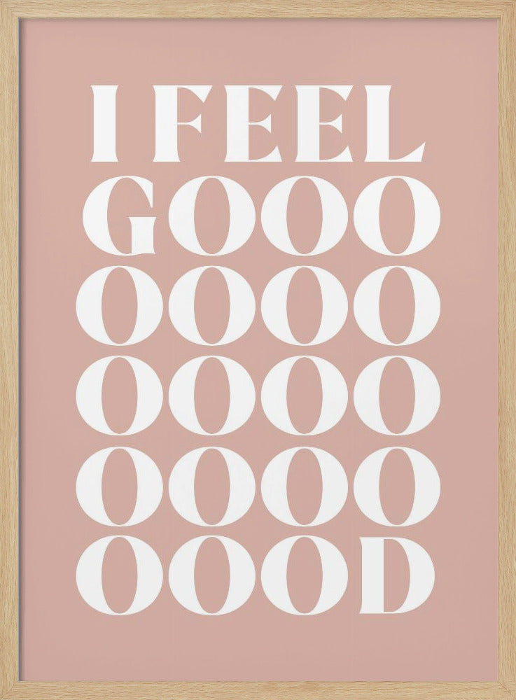 A framed typographic poster featuring the words 'I FEEL GOOOOOD' in a large, white serif font against a dusty pink background. The word 'GOOD' is stylized and stretched vertically with multiple rows of the letter 'O'. Artwork