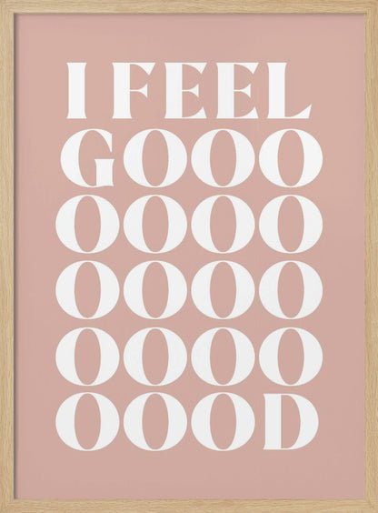 A framed typographic poster featuring the words 'I FEEL GOOOOOD' in a large, white serif font against a dusty pink background. The word 'GOOD' is stylized and stretched vertically with multiple rows of the letter 'O'. Artwork