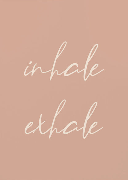 A minimalist framed poster featuring the words 'inhale' and 'exhale' in a flowing white script font, stacked vertically against a solid dusty pink background. Poster