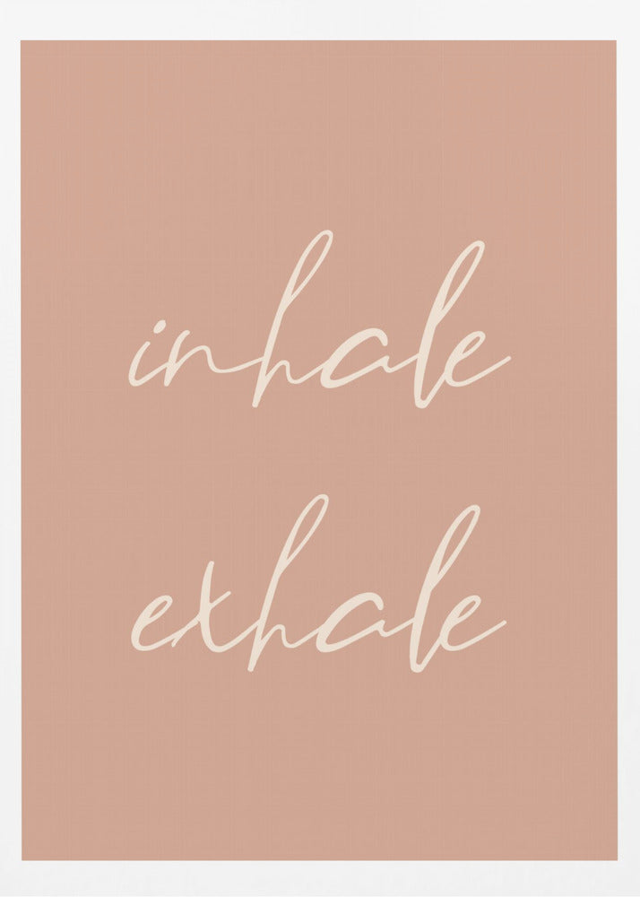 A minimalist framed poster featuring the words 'inhale' and 'exhale' in a flowing white script font, stacked vertically against a solid dusty pink background. Poster