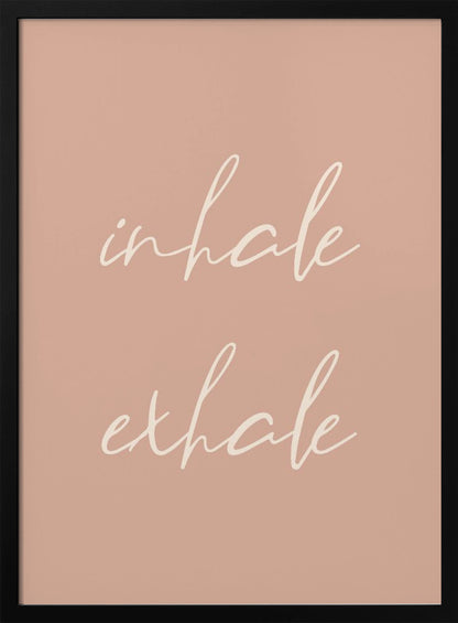 A minimalist framed poster featuring the words 'inhale' and 'exhale' in a flowing white script font, stacked vertically against a solid dusty pink background. Poster