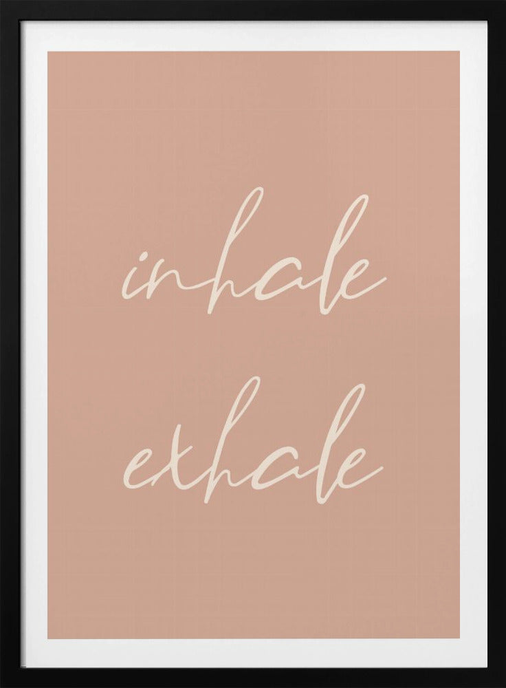 A minimalist framed poster featuring the words 'inhale' and 'exhale' in a flowing white script font, stacked vertically against a solid dusty pink background. Poster