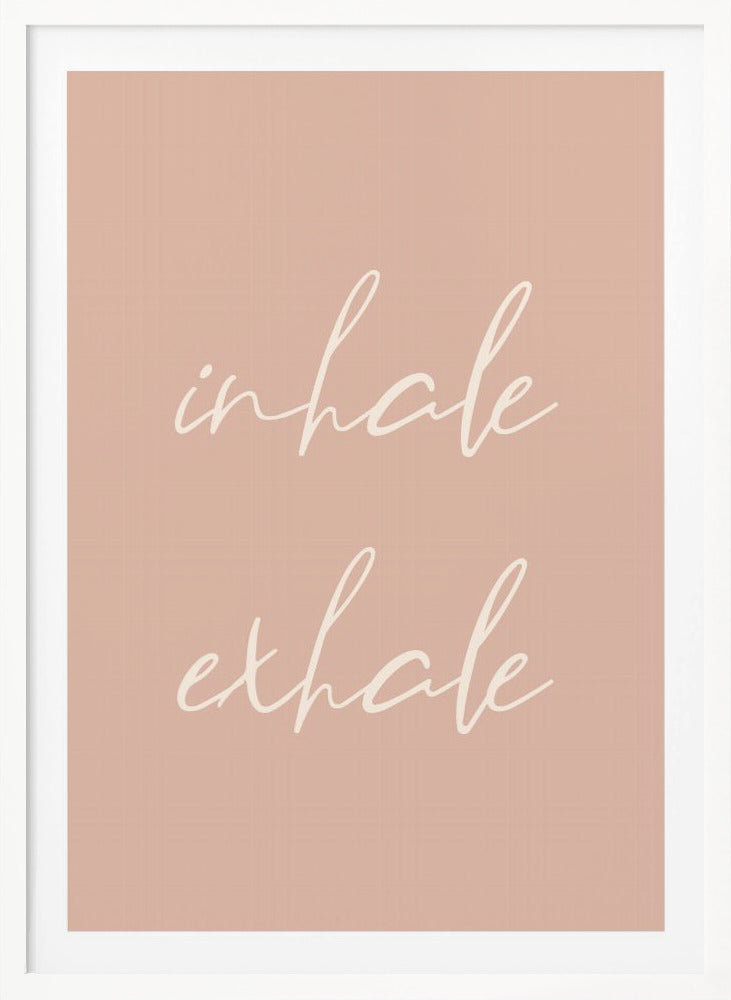 A minimalist framed poster featuring the words 'inhale' and 'exhale' in a flowing white script font, stacked vertically against a solid dusty pink background. Poster