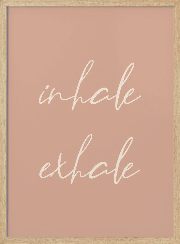 A minimalist framed poster featuring the words 'inhale' and 'exhale' in a flowing white script font, stacked vertically against a solid dusty pink background. Poster