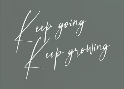 A motivational art piece featuring the words 'Keep going' and 'Keep growing' in a delicate white script on a muted sage green background, set within a simple silver frame. Print