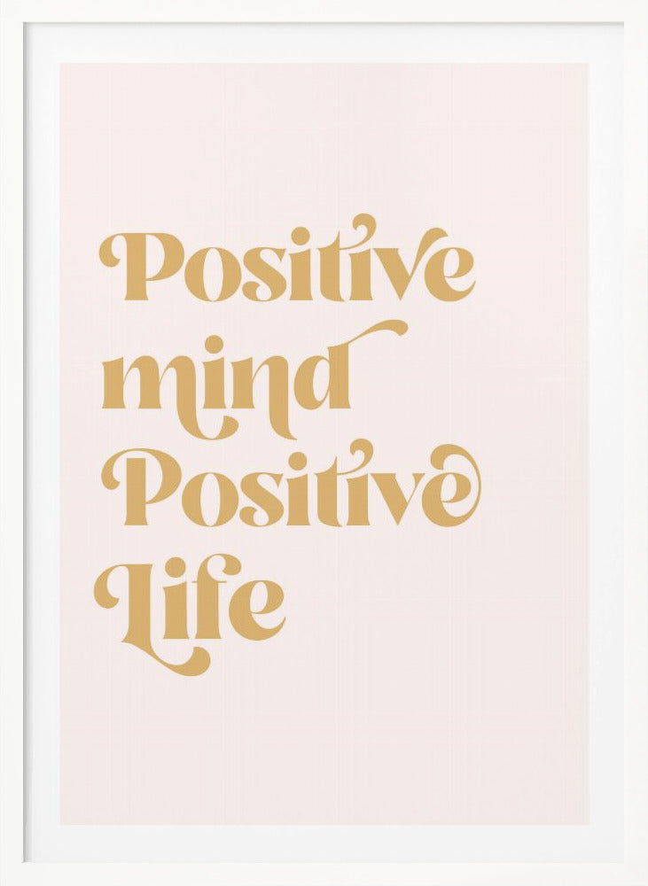 A framed art print featuring the motivational quote 'Positive mind Positive life' in a gold, retro-style font against a light pink background. The text is centered and arranged vertically. Artwork