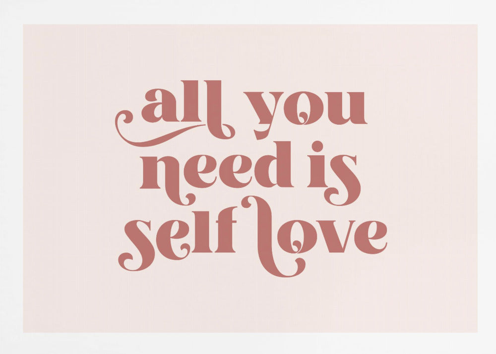 A framed art print with the phrase 'all you need is self love' in a stylish, dusty rose serif font on a light pink background. The artwork is enclosed in a simple silver frame. Poster