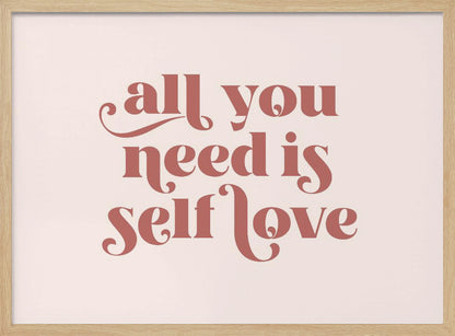 A framed art print with the phrase 'all you need is self love' in a stylish, dusty rose serif font on a light pink background. The artwork is enclosed in a simple silver frame. Poster