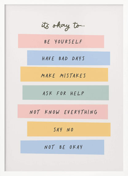 A framed inspirational poster with a white background. At the top, in a black handwritten font, it says 'it's okay to...'. Below is a list of affirmations, each on a different colored pastel rectangle: 'BE YOURSELF' on pink, 'HAVE BAD DAYS' on blue, 'MAKE MISTAKES' on yellow, 'ASK FOR HELP' on green, 'NOT KNOW EVERYTHING' on pink, 'SAY NO' on yellow, and 'NOT BE OKAY' on blue. Poster