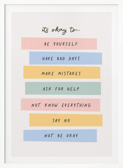 A framed inspirational poster with a white background. At the top, in a black handwritten font, it says 'it's okay to...'. Below is a list of affirmations, each on a different colored pastel rectangle: 'BE YOURSELF' on pink, 'HAVE BAD DAYS' on blue, 'MAKE MISTAKES' on yellow, 'ASK FOR HELP' on green, 'NOT KNOW EVERYTHING' on pink, 'SAY NO' on yellow, and 'NOT BE OKAY' on blue. Poster
