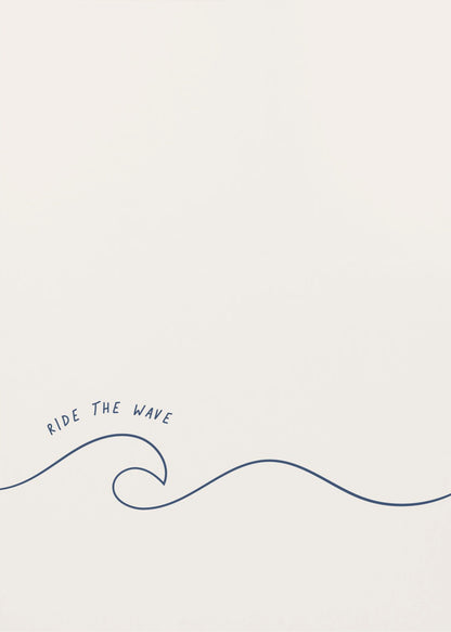 A minimalist art print in a black frame featuring a single dark blue line that forms a simple ocean wave on an off-white background. The words 'RIDE THE WAVE' are written in a casual, handwritten font above the crest. Wall Art