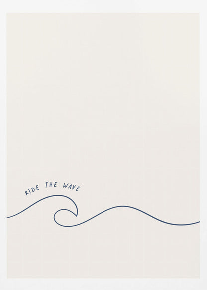 A minimalist art print in a black frame featuring a single dark blue line that forms a simple ocean wave on an off-white background. The words 'RIDE THE WAVE' are written in a casual, handwritten font above the crest. Wall Art