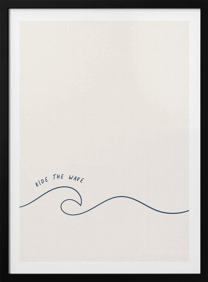 A minimalist art print in a black frame featuring a single dark blue line that forms a simple ocean wave on an off-white background. The words 'RIDE THE WAVE' are written in a casual, handwritten font above the crest. Wall Art
