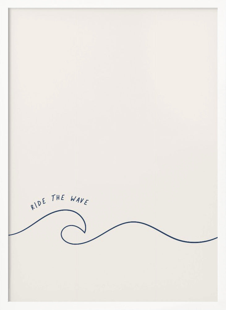 A minimalist art print in a black frame featuring a single dark blue line that forms a simple ocean wave on an off-white background. The words 'RIDE THE WAVE' are written in a casual, handwritten font above the crest. Wall Art